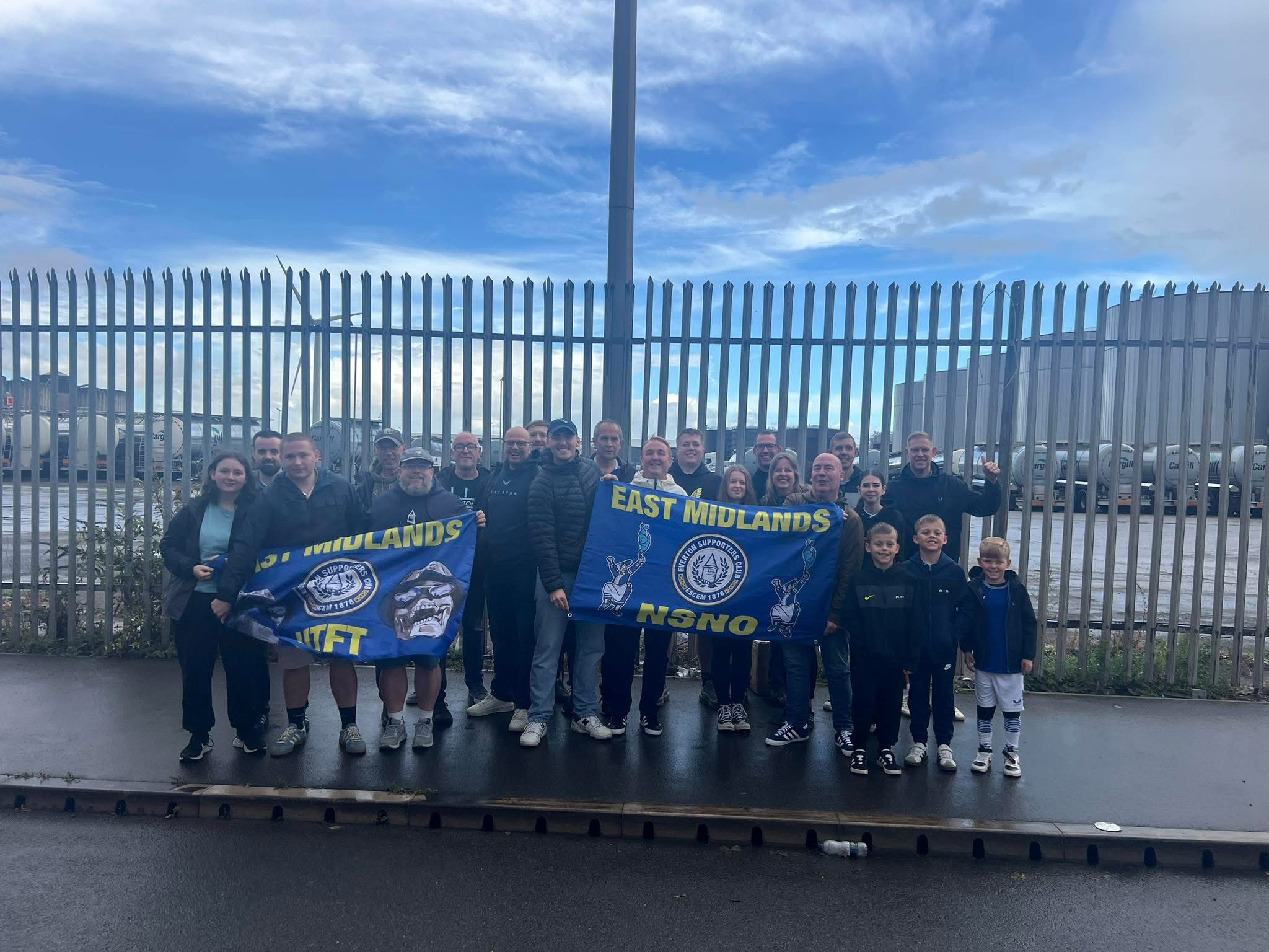 ESCEM members with East Midlands flags outside the ground